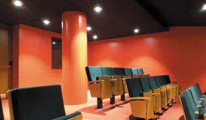 Sound-absorbing coverings to reduce noise and reverberation in auditoriums